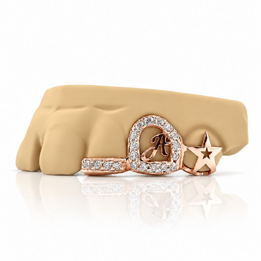 Custom 3pc grillz with moissanite initial letter, open star and textured band, rose gold plated 925 silver - angle 1