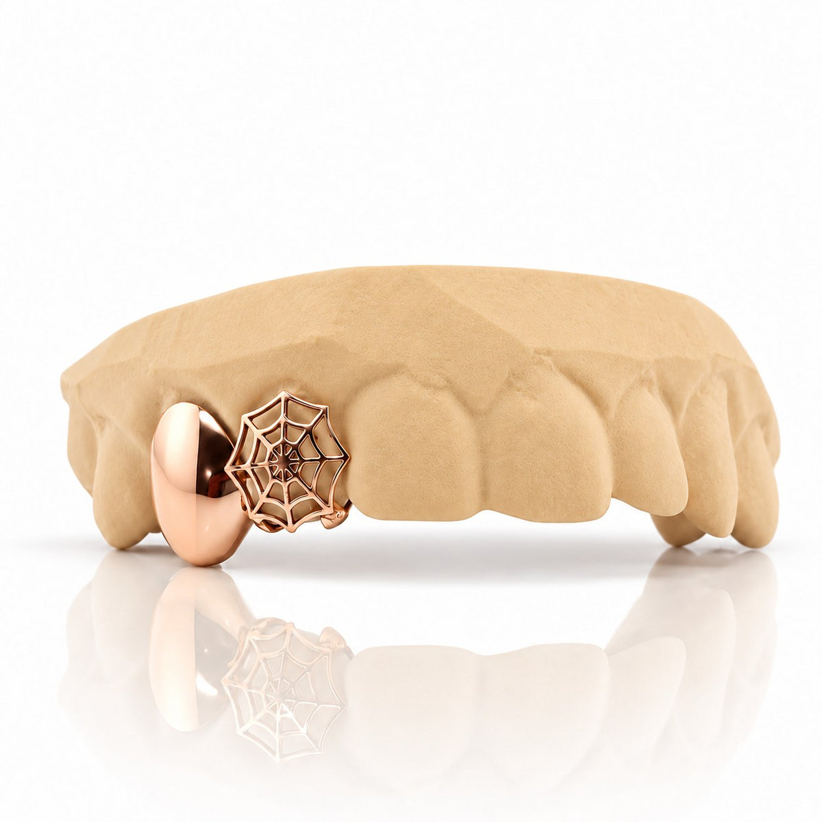 Custom 2pc top grillz with solid cap and spiderweb cutout, rose gold plated 925 silver - angle 1